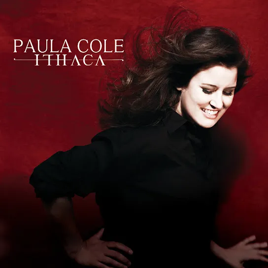album cover featuring a brunette woman in a black shirt looking down and smiling