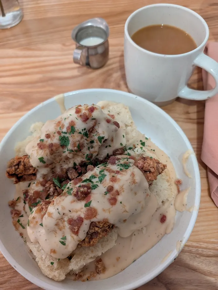 chicken with biscuits and gravy and a coffee