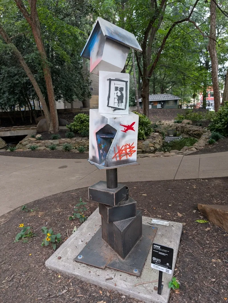 a sculpture with intentional graffiti
