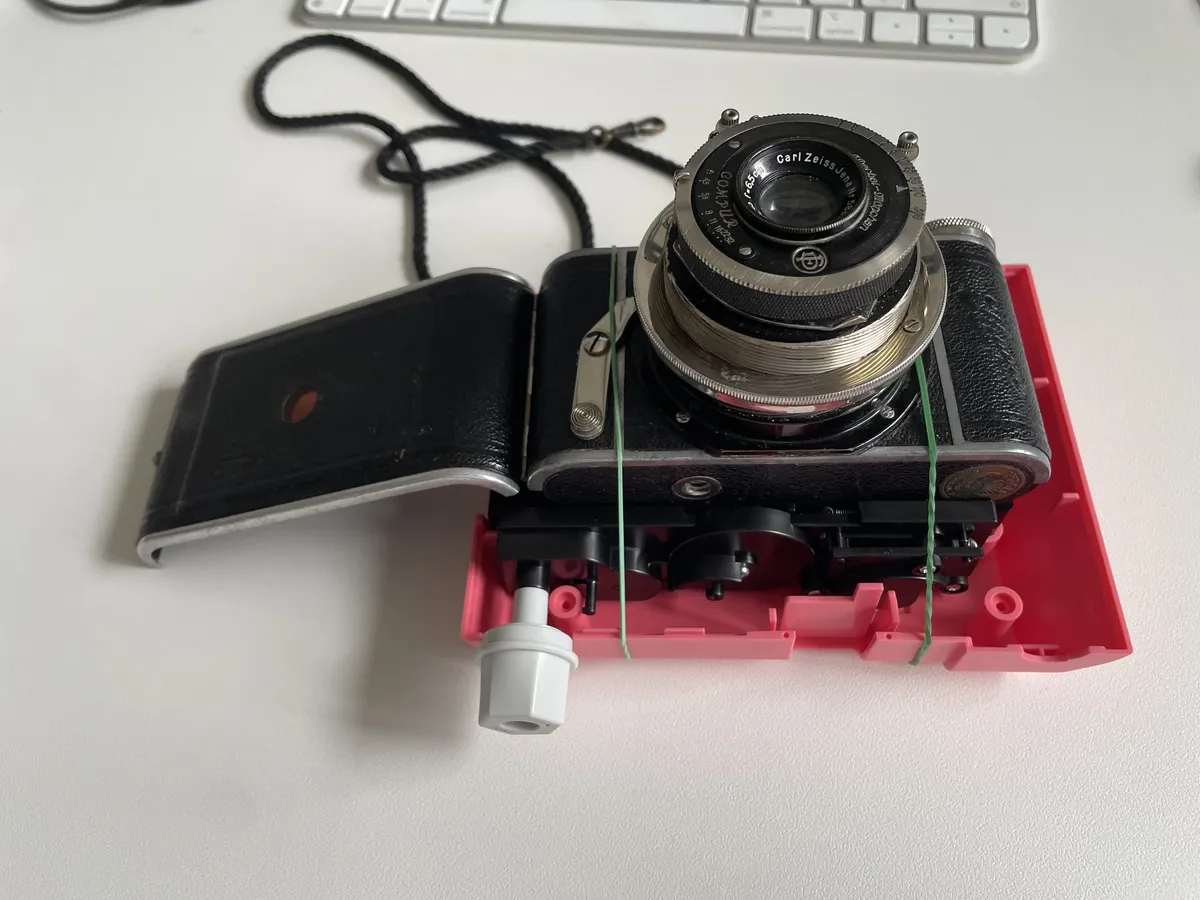 The contraption - a toy camera strapped to a vintage camera