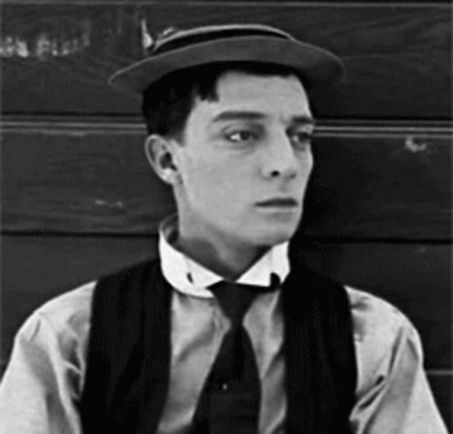 black and white gif of Buster Keaton doffing his hat