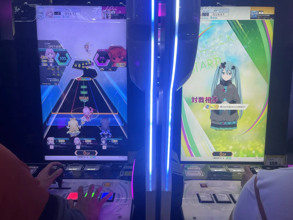 A newfangled music game where you fight Hatsune Miku with your waifus with a joystick, six buttons in front of you, and two buttons on the wall