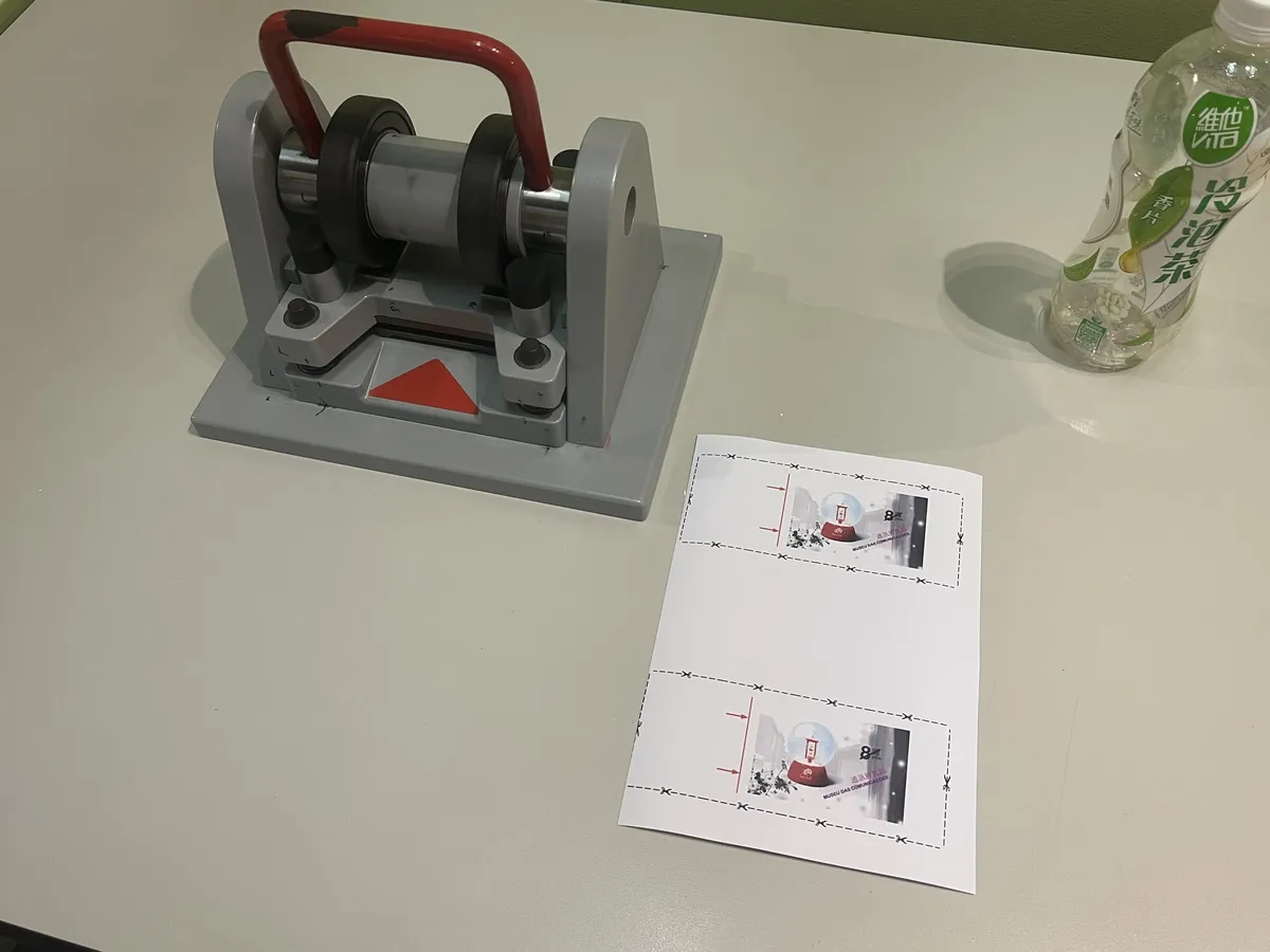 Me in the kids area making a “stamp” by selecting images and printing it out, then putting it into the die cutter for the perforations. I have a stupid amount of fun by myself.