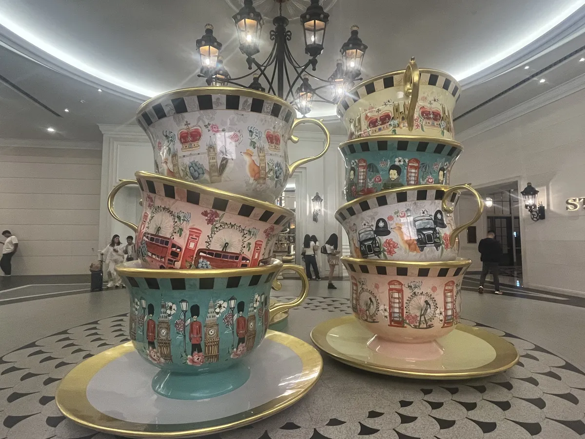 Behind the teacups is one that you can sit in. We rounded the corner to make eye contact with a family squished inside eating snacks 😂