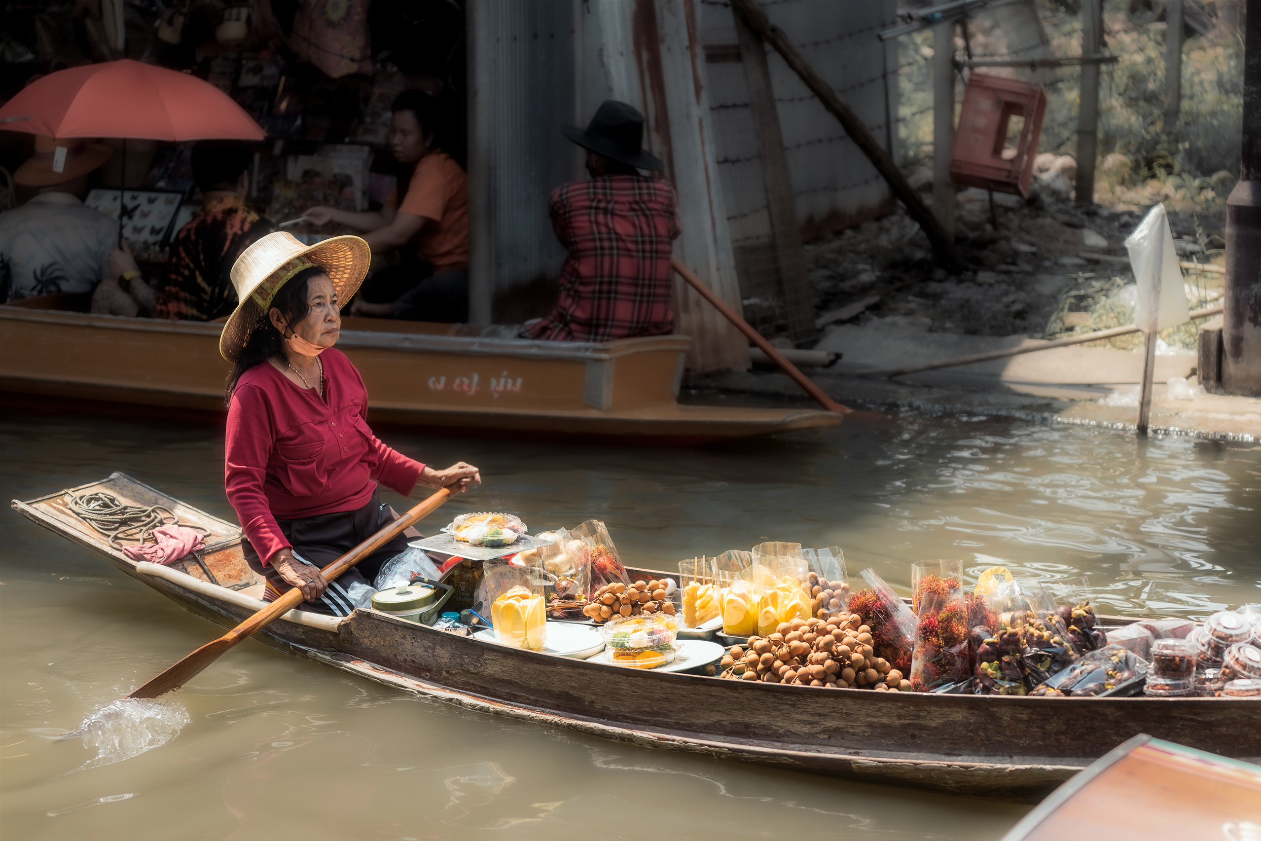 Woman rowing a boat, symbolizing balance and effort