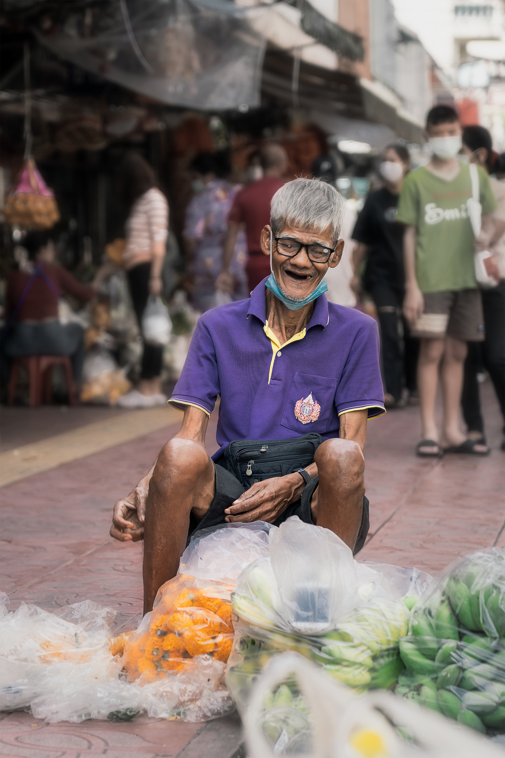 Smiling man in purple shirt
