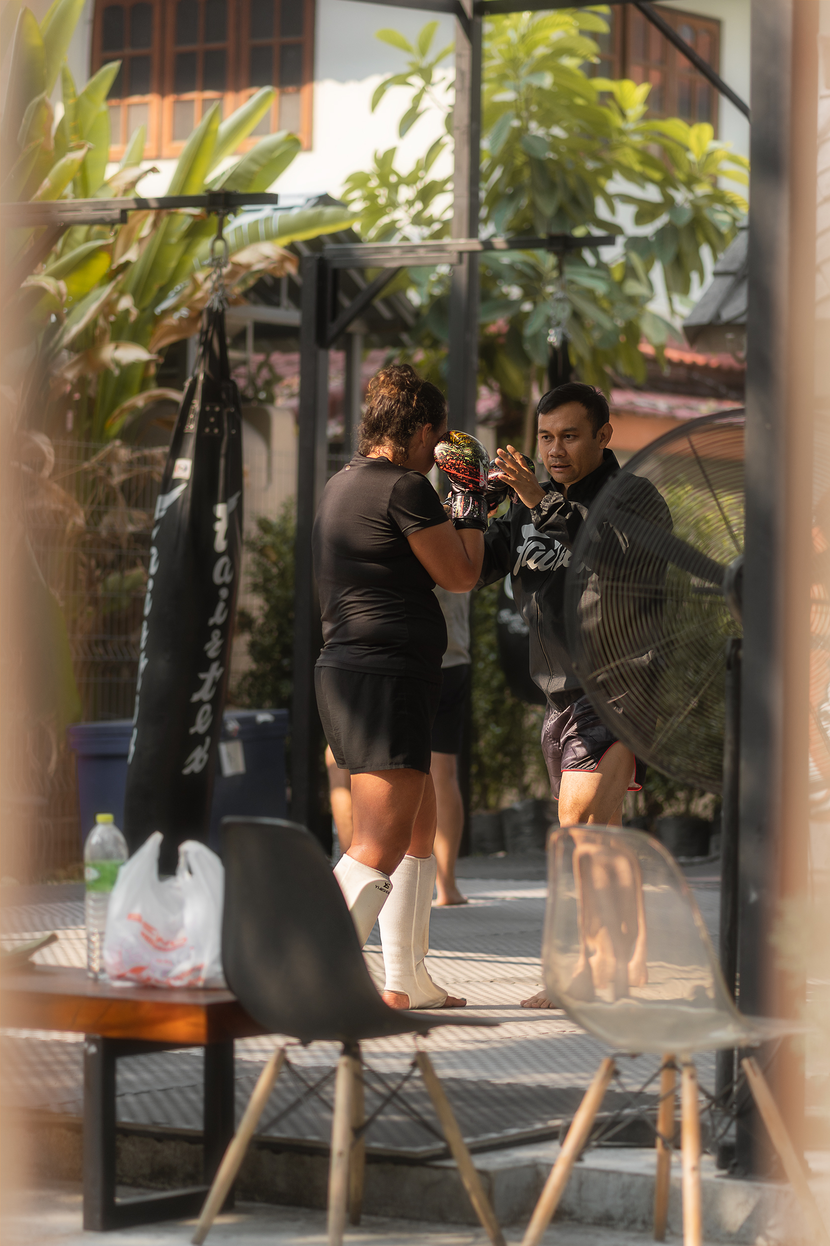 Man training with a punching bag - portrait 1