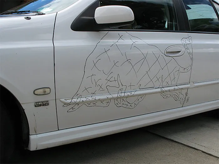 The bull drawn on the doors in black marker