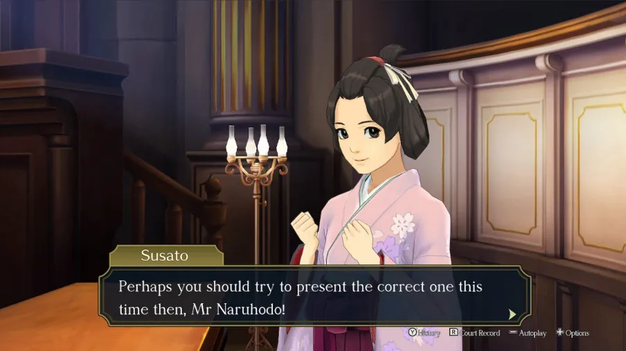 A screenshot of Susato, looking encouraging, suggesting "Perhaps you should try to present the correct one this time then, Mr Naruhodo!"