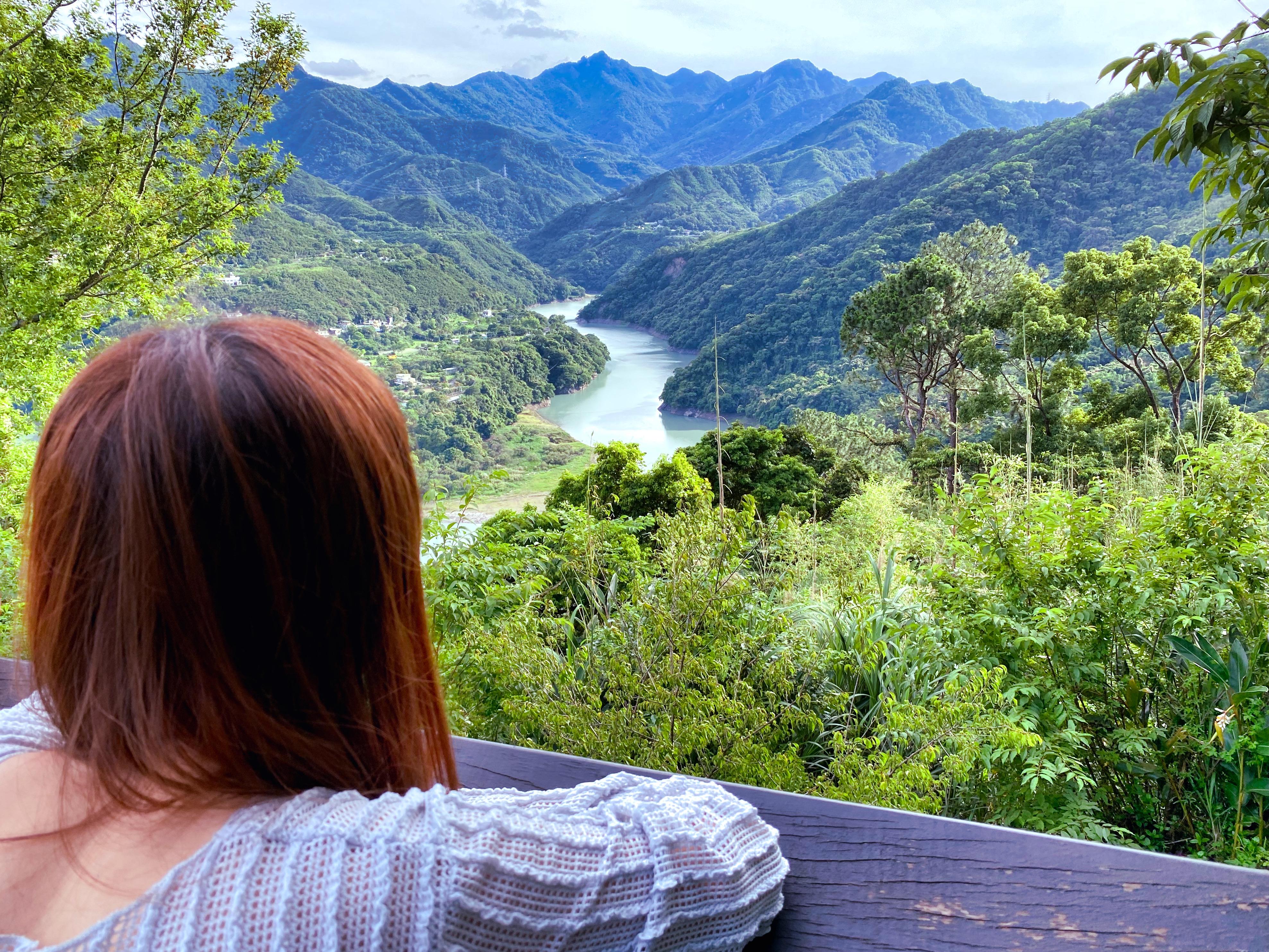 Girl looking a mountain and river views at Jiaobanshan Park