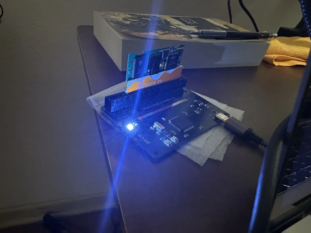 A WonderSwan flashcart inside a flasher connected with USB-C, all with circuits exposed.