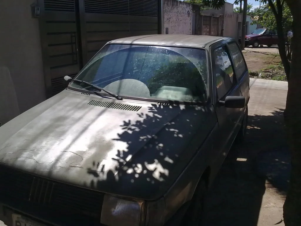 A photo of and old, beaten-up, Fiat Uno