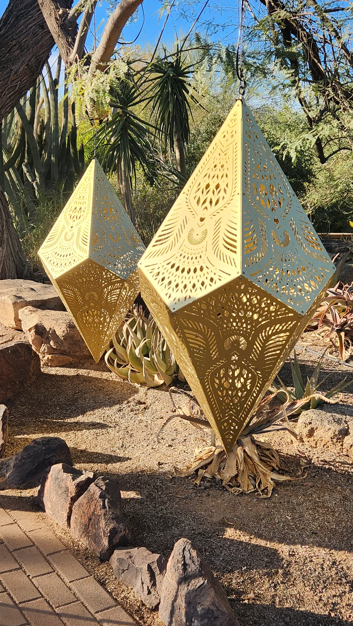 Large golden intricate and pointy ornament sculptures outside