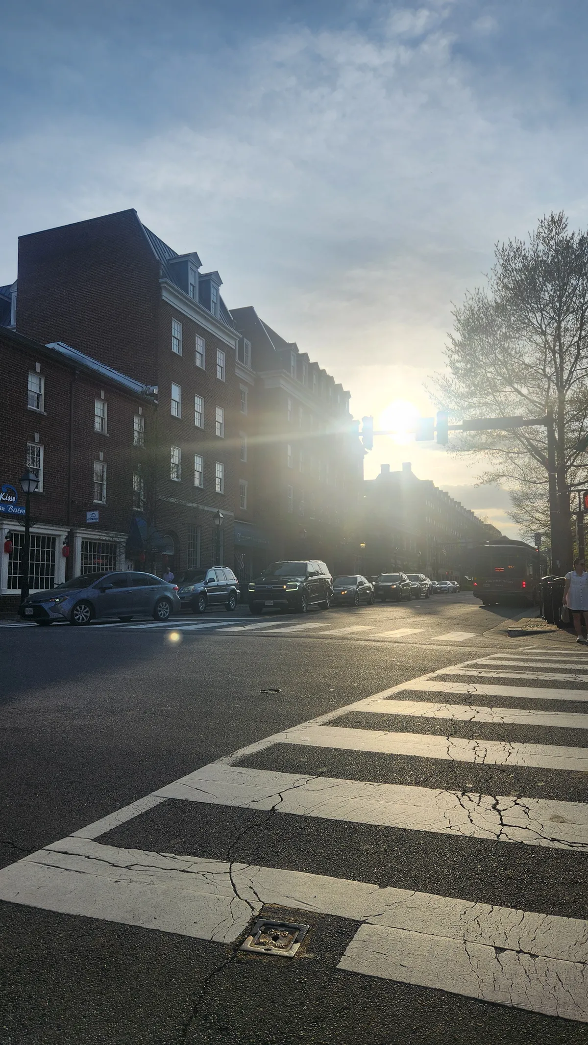Sunset through buildings shining onto a city street
