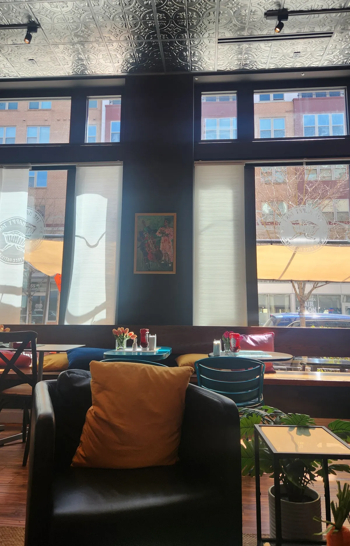 indoors of a coffee shop with cozy chairs and tables