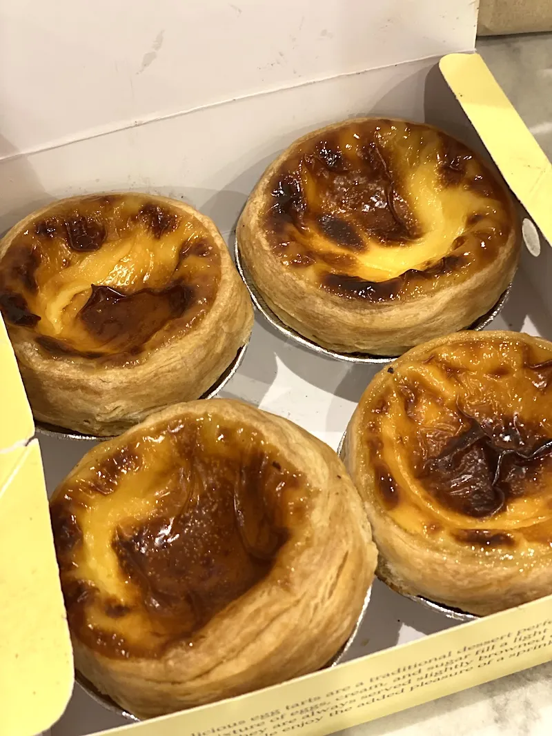 A box of Lord Stow's egg tarts, still warm