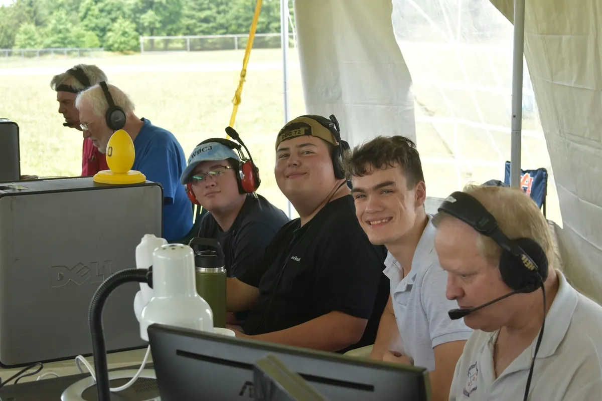 L to R: WW0CJ, W4IPC, and K4BEN operating at the 10m station.