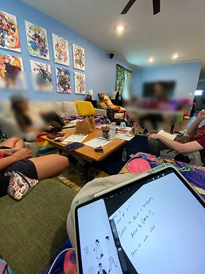 People sitting around a table playing Dungeons & Dragons IMG_4273