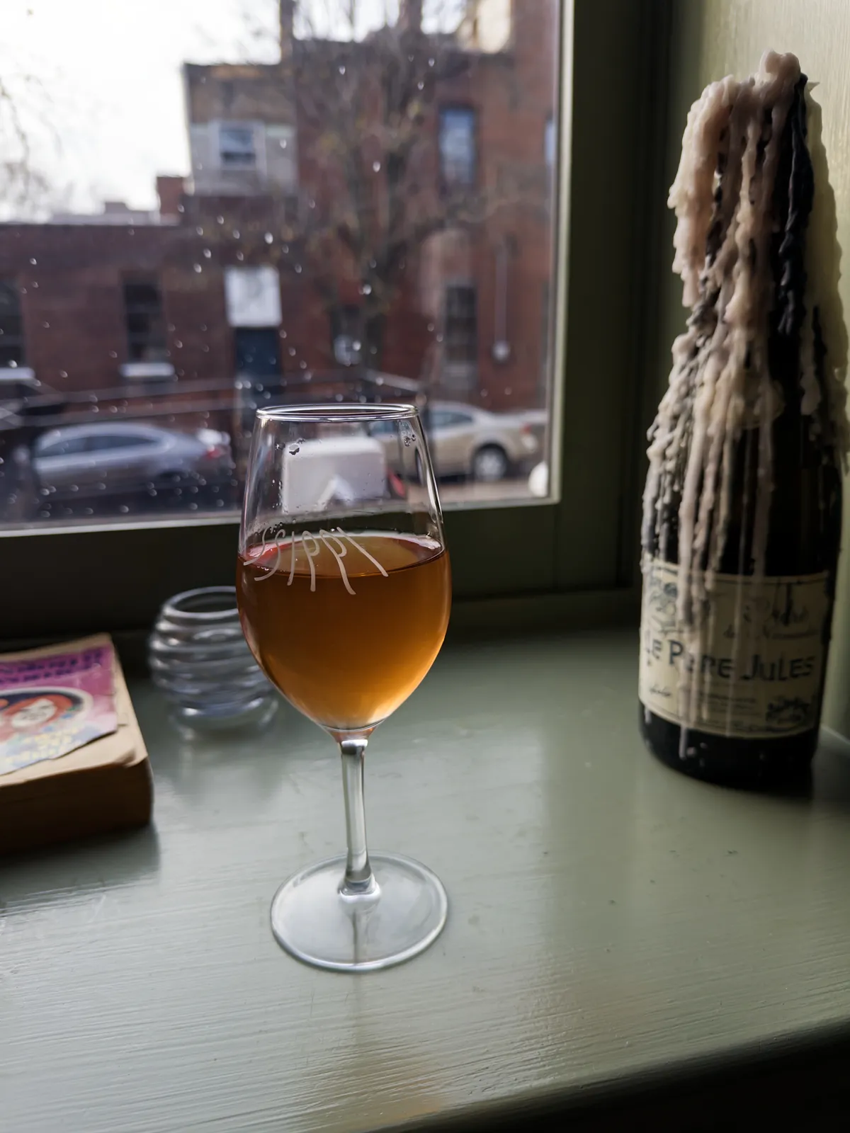 I'm still learning how to describe orange wines, so in lieu of actual words, here's how the glass looks when backlit on a wintery day.