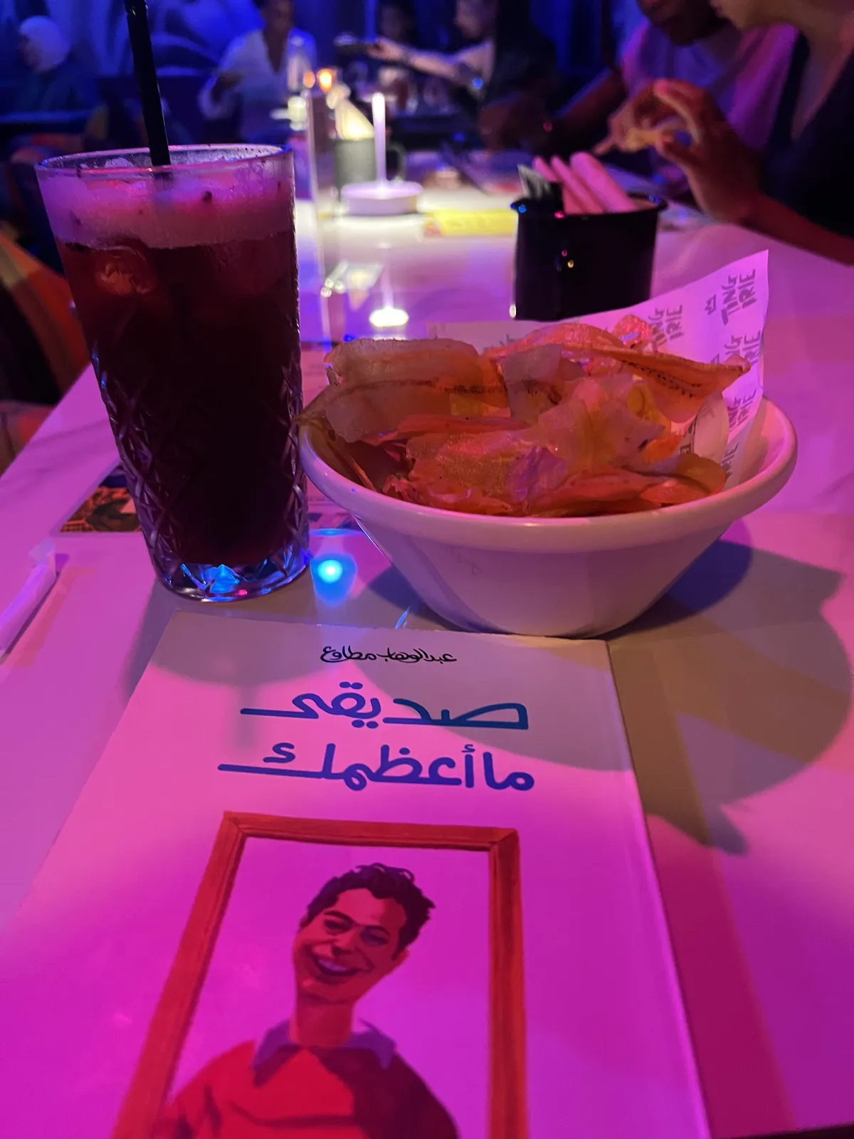 Book, plantain crisps and a mocktail