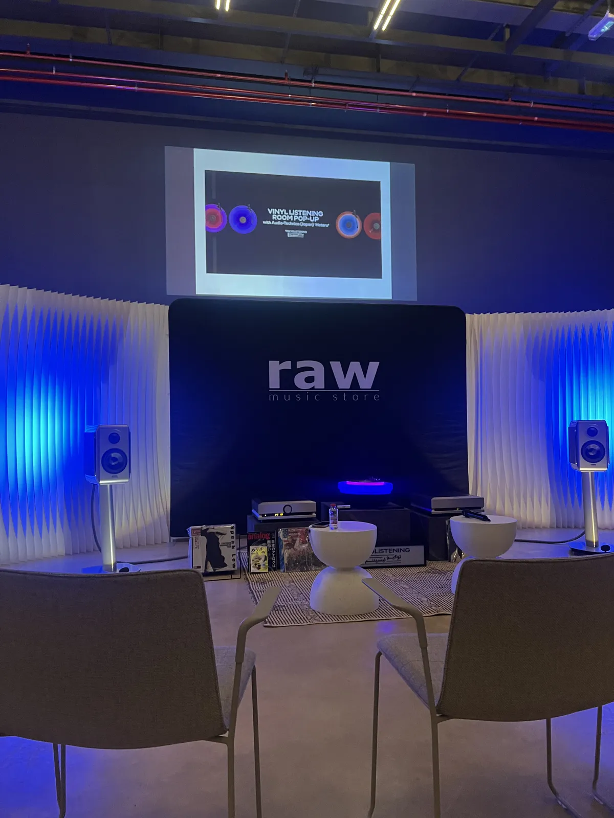 Vinyl records, record players and fancy speakers at a music listening pop-up