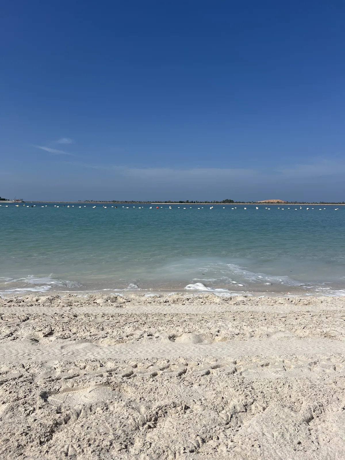 Sandy beach with gentle waves