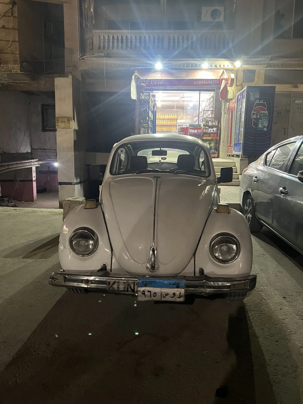 Cute old white car with an Egyptian license plate