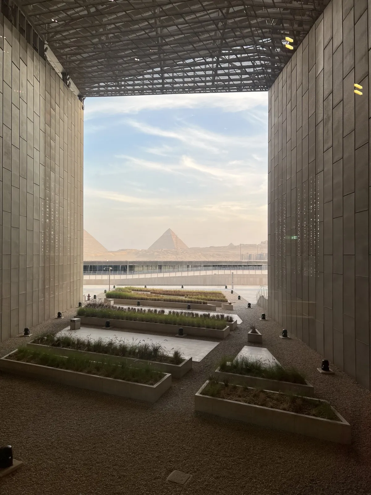 View from the Grand Egyptian Museum with the pyramids in the distance