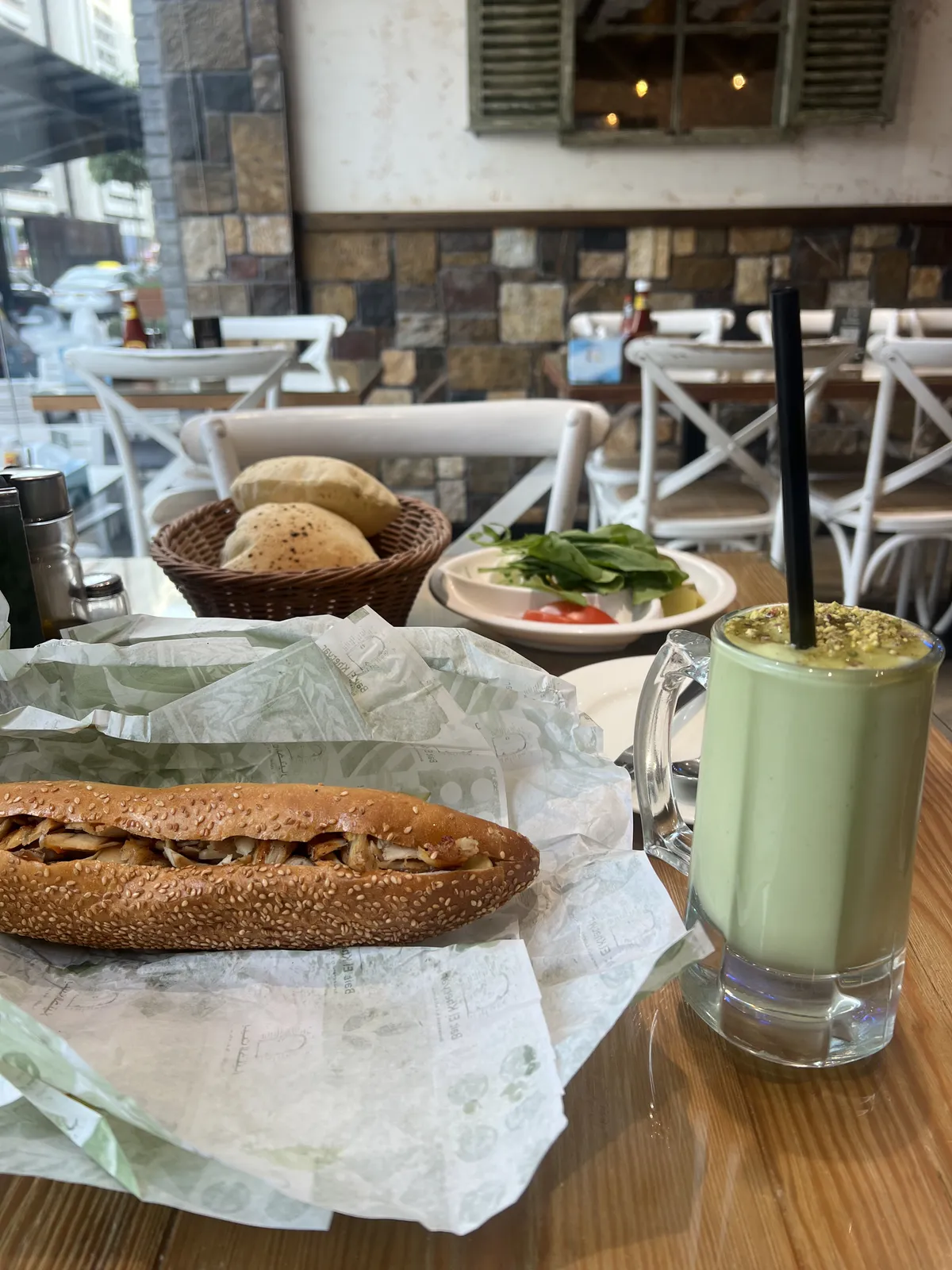 Jerusalem bagel stuffed with shawarma, served with avocado juice