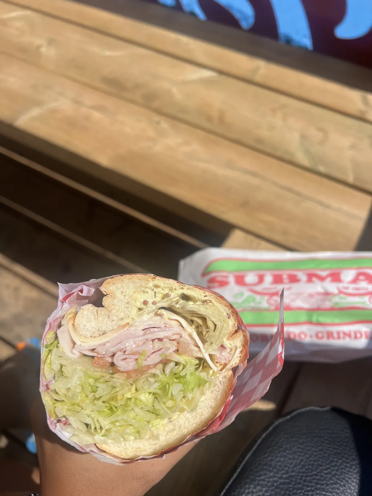 Sandwich overflowing with lettuce