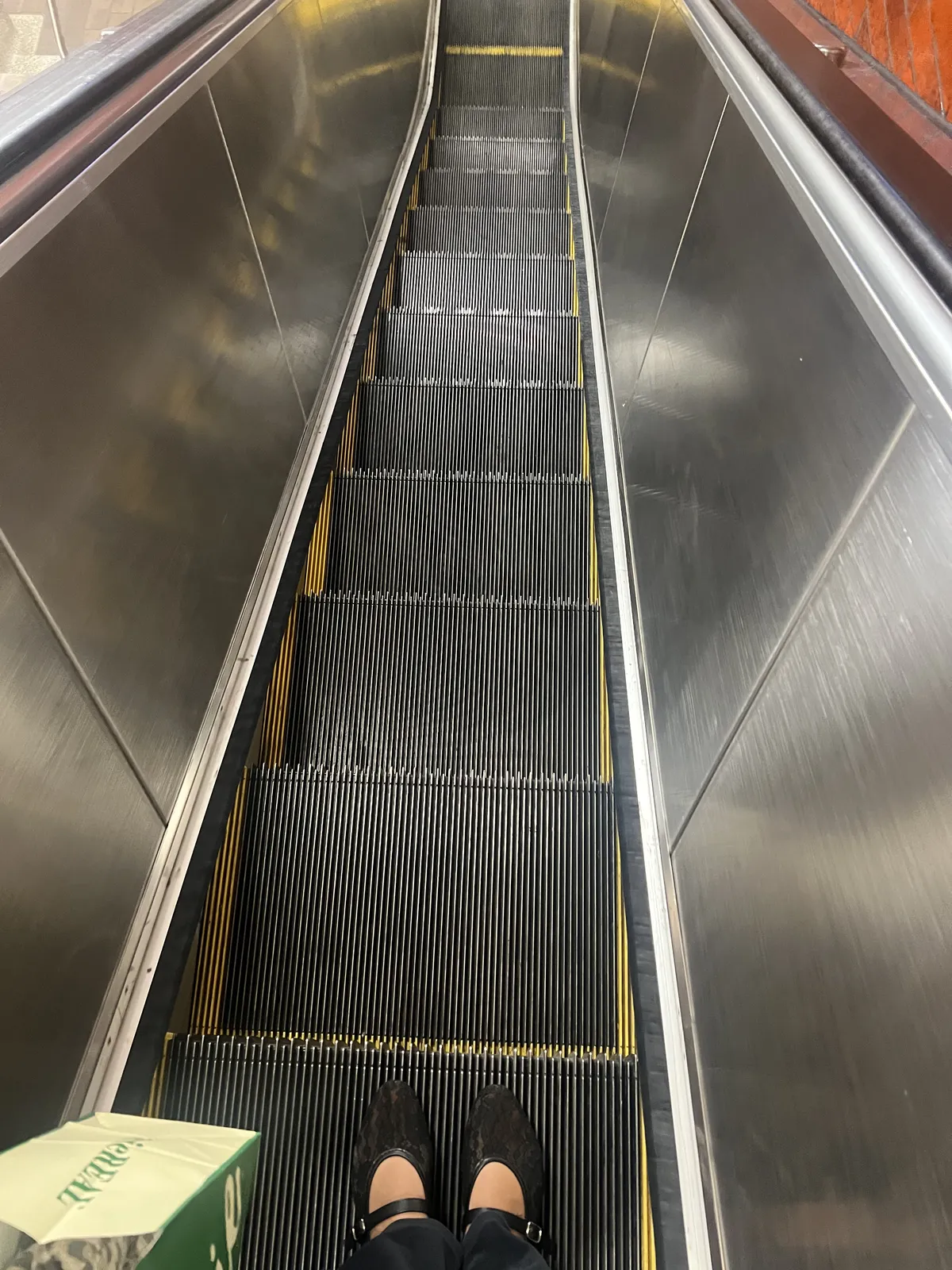 Skinny minny escalator with a glimpse of my black flats