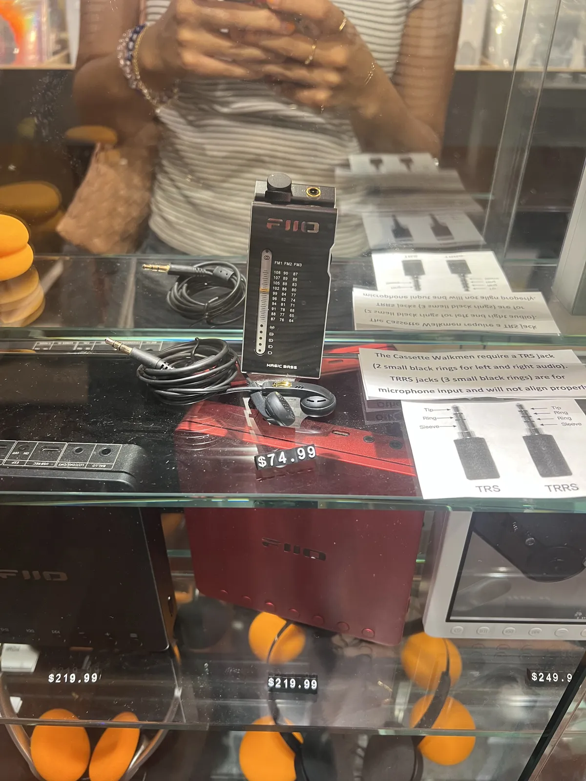 A FiiO RR11 behind a glass display