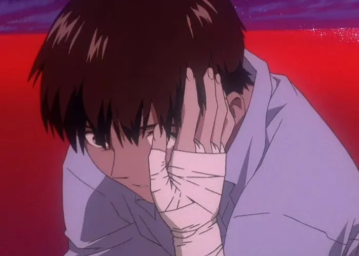 a boy with short brown hair has a bandaged hand (Asuka's) on his face. He's looking at it with disbelief. The background is a red ocean.